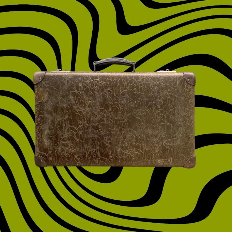 May include: A vintage brown suitcase with a textured surface and metal corner protectors. The suitcase has a black handle and is set against a green background with black wavy lines. A classic travel accessory.