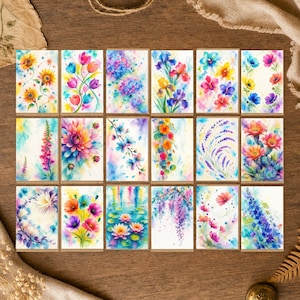 Peut inclure: Une collection de dix-huit cartes rectangulaires présentant des illustrations aquarelles vibrantes de diverses fleurs, notamment des tournesols, tulipes, hortensias, iris, coquelicots, lavande, cactus, nénuphars et glycines aux tons colorés.