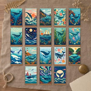 Peut inclure: Une collection de dix-sept cartes rectangulaires présentant des illustrations colorées de baleines dans divers environnements aquatiques, incluant des récifs coralliens, des ciels étoilés, des eaux glacées et des paysages côtiers.