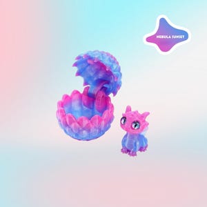 May include: A fantasy-themed set featuring a dragon figurine and a shell-like container. The dragon is pink and blue with large eyes. The container is also pink and blue, with a textured, open design. The text "NEBULA SUNSET" is on a sticker.