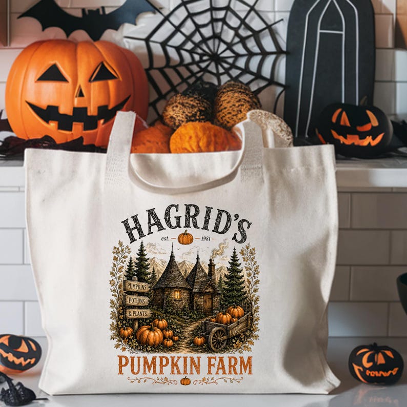 May include: A cream-colored canvas tote bag featuring a graphic print of a cottage, pine trees, and pumpkins. The text reads HAGRID'S est. 1981 PUMPKIN FARM, with smaller signs labeled PUMPKINS, POTIONS, and PLANTS integrated into the illustration.