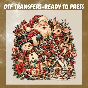 May include: A DTF transfer sheet featuring a festive illustration with Santa Claus, a reindeer, a snowman, a nutcracker, a decorated Christmas tree, wrapped gifts, a small house, and the text DTF TRANSFERS-READY TO PRESS at the top.