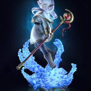 May include: A fantasy figurine of a character with pointed ears, wearing a white and gold outfit, and holding a staff with a red gem. The character stands on a base of blue flames, with a dark blue background.