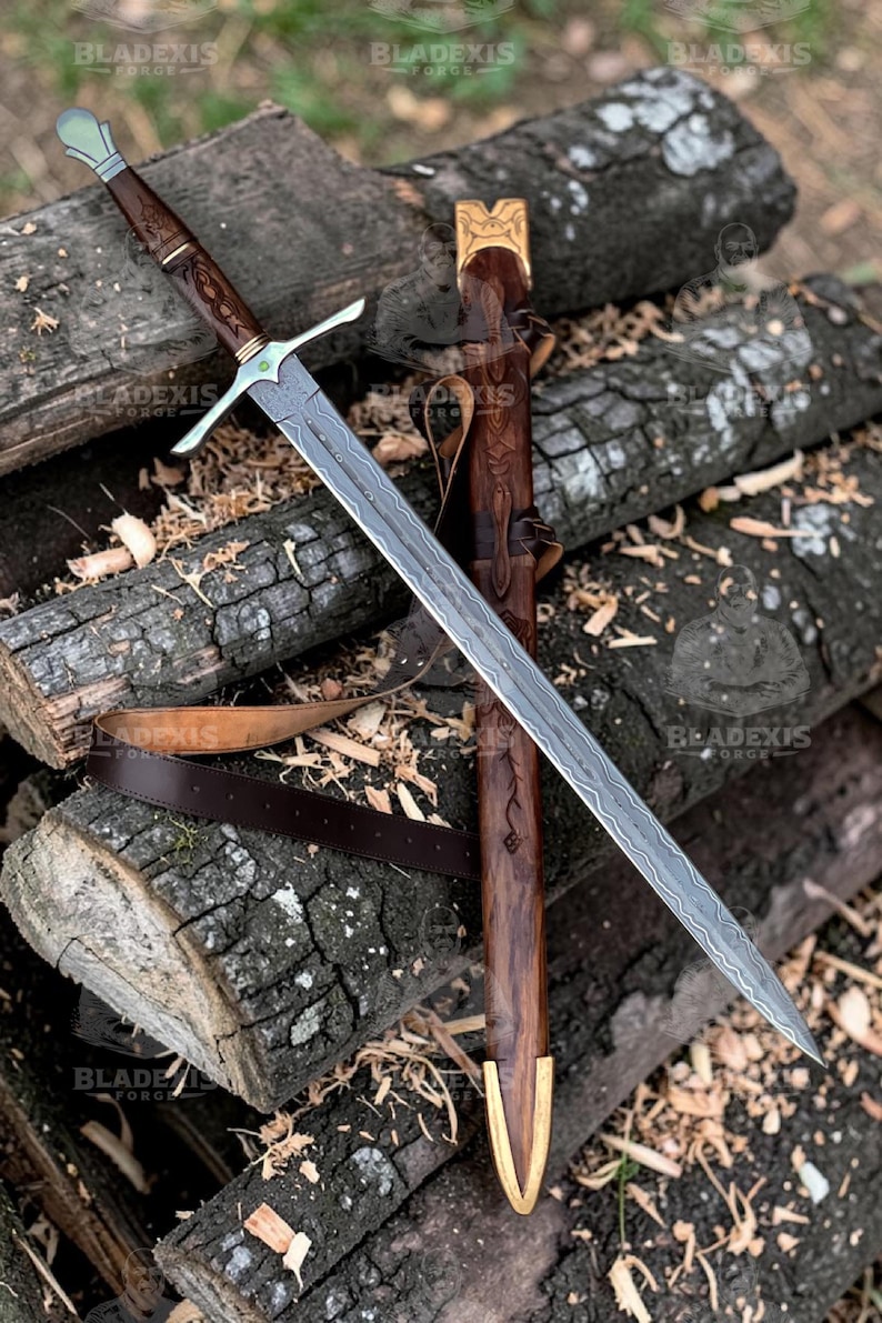 May include: A detailed image of a sword with a patterned blade and a wooden handle. The sword is resting on a pile of logs, with a matching wooden sheath. The handle has intricate carvings and a metal crossguard. The sheath has a leather belt.