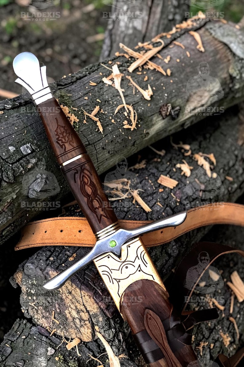 May include: A detailed image of a sword with a wooden handle and a silver blade. The handle is intricately carved with a dark brown finish, and the blade is silver. The sword rests on a wooden surface.