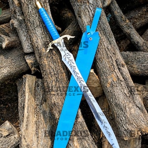 May include: A sword with a bright blue wrapped handle, a gold-toned pommel, and a decorative brass crossguard. The steel blade features an etched vine and leaf pattern. It is accompanied by a matching bright blue leather scabbard with a strap.