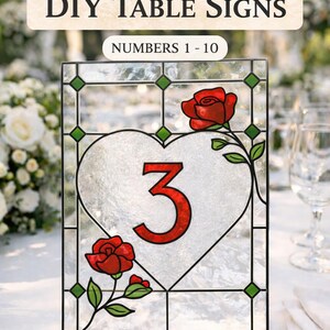May include: DIY table sign with a heart-shaped design, featuring the number 3 in red. The sign is decorated with red roses and green leaves. The text "SIZED 5x7 DIY TABLE SIGNS NUMBERS 1-10" is displayed at the top.