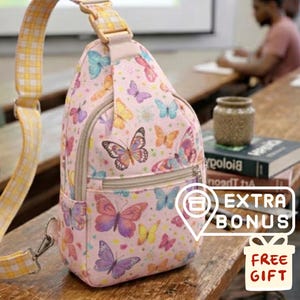 May include: Pink sling bag featuring a colourful butterfly print. The bag has a zip-up main compartment and an adjustable strap with a yellow and white check pattern. It also has a small front pocket.