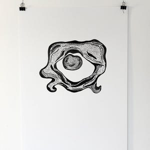 May include: Monochrome abstract art print. The artwork presents a central circular form with intricate, textured detailing. The outer shape is an irregular, flowing design, creating a unique visual effect. The print is displayed on a white background.