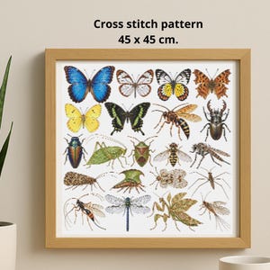 May include: A framed cross stitch pattern measuring 45 x 45 cm. The artwork features a grid of various insects, including butterflies, a wasp, a beetle, a grasshopper, a dragonfly, and a praying mantis, rendered in detailed, colorful embroidery.