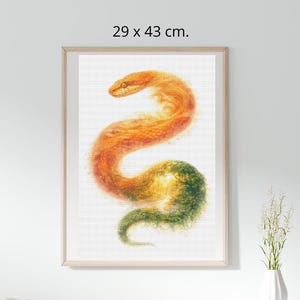 May include: Framed artwork featuring a stylized snake in shades of orange, yellow, and green. The snake is depicted in a flowing, abstract style. The artwork measures 11.4 x 16.9 inches and is displayed in a light-colored wooden frame.