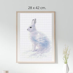 May include: Framed art print featuring a white rabbit with a watercolor effect. The artwork measures 11 x 16.5 inches and is set against a white background. The rabbit is depicted in profile, with a soft, dreamy quality. The frame is a light wood color.
