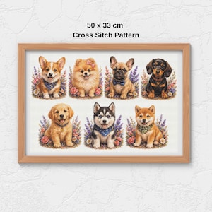 Può includere: Un modello a punto croce incorniciato con otto diverse razze di cani, ciascuna circondata da composizioni floreali. L'opera misura 50 x 33 cm e include il testo "Cross Stitch Pattern".
