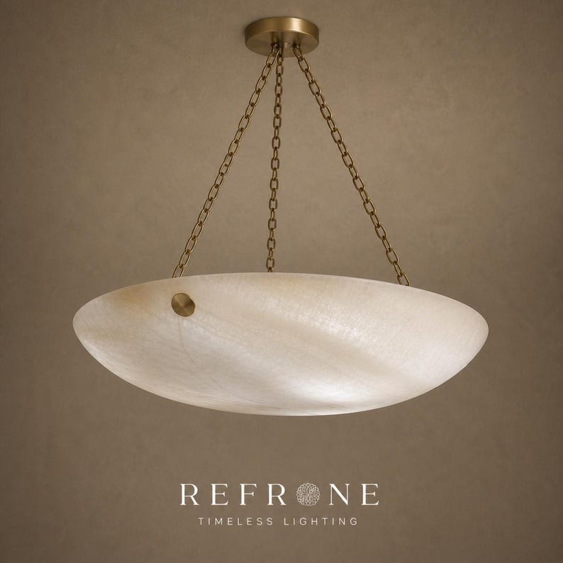 Wider ceiling perspective showing alabaster ceiling light suspended by brass chain, round brass canopy above