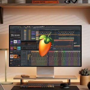 May include: A computer setup featuring a large monitor displaying music production software with a prominent orange fruit logo. Two black speakers flank the screen, with a keyboard, mouse, and headphones in the foreground. The text "FL STUDIO 2025" is visible.