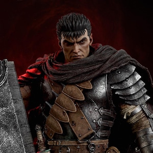May include: A detailed statue of a warrior in dark armor, featuring a stern expression and a scar across his face. He wears a dark scarf and holds a large, textured shield. The figure is set against a dark red background.