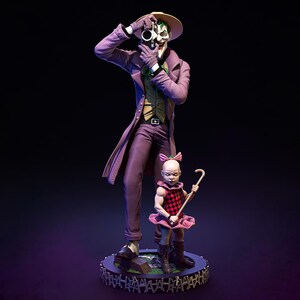 May include: A detailed statue of the Joker in a purple suit and hat, holding binoculars. A small figure in a pink dress and a cane stands beside him. The figures are on a circular base with a fence design, set against a dark background.