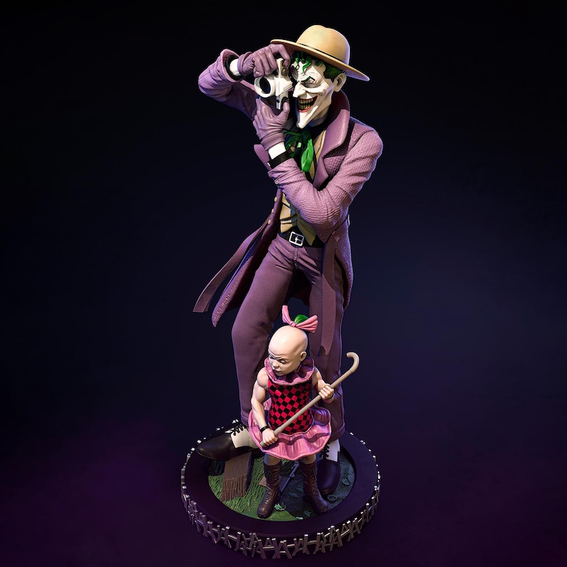 May include: A detailed statue of the Joker character from DC Comics, in a purple suit and hat, holding a skull. A small child in a pink dress and boots stands at his feet. The statue is on a circular base with a chain-like border.
