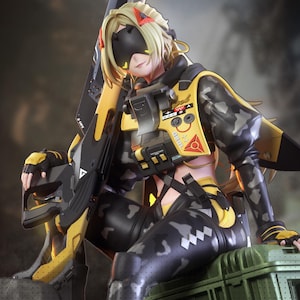 May include: A detailed figurine of a female character in a futuristic military outfit. The figure is predominantly black and yellow, with camouflage patterns. She is holding a large weapon and wearing a visor.