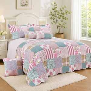 May include: A patchwork quilt and matching pillow shams featuring a repeating pattern of floral prints, stripes, and geometric designs in shades of pink, teal, and white. The bedding set includes a square throw pillow with a scalloped edge finish.
