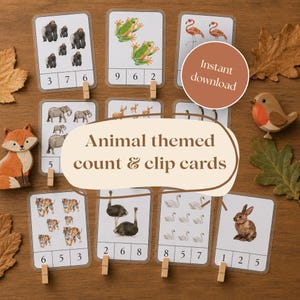以下が含まれることがあります： ゴリラ、カエル、フラミンゴ、ゾウ、トラ、ダチョウ、ハクチョウ、ウサギなどの様々な動物の水彩画が描かれた、長方形のカウント＆クリップカードセット。各カードの下部には、数える練習をするための数字が記載されています。