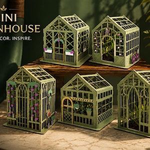 May include: A collection of miniature green greenhouses, each with detailed designs and floral decorations. The image displays several small structures with unique architectural features. The text "MINI GREENHOUSE" is visible at the top, with the words "CRAFT. DECOR. INSPIRE."