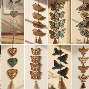 May include: A collection of ten vertical hanging wall decorations featuring laser-cut wooden shapes including butterflies, hearts, and birds. Each string includes four repeating elements and a bottom tassel. Text includes INSTANT DOWNLOAD SVG PNG DFX PDF EPS CDR 10 FILES.