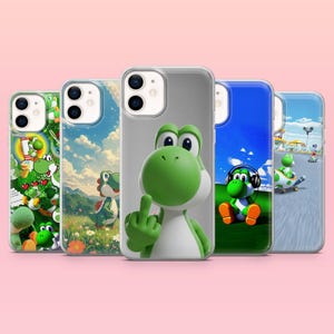 May include: Five phone cases with Yoshi designs. The cases have clear edges and feature colourful images of Yoshi in different poses and settings, including a landscape and a blue sky.