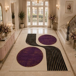 Art Deco inspired washable carpet with bold abstract curves and sophisticated glam home styling.