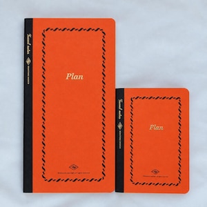 May include: Two orange notebooks with black spines and borders. The front covers feature the word Plan in gold text, with Travel notes and Benstore Design printed on the spine. A small logo and copyright text appear at the bottom of each cover.