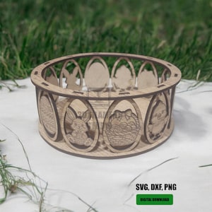 May include: A laser-cut wooden Easter basket with egg-shaped cutouts featuring Easter-themed designs. The basket includes images of a bunny, a chick, and an Easter basket. The text "SVG, DXF, PNG" and "DIGITAL DOWNLOAD" are visible.
