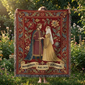 May include: A red woven throw blanket with a medieval king and queen design. The blanket has a floral border and the names "Benjamin" and "Jennifer" with the date "19.02.2026" on a banner. The blanket has fringe.