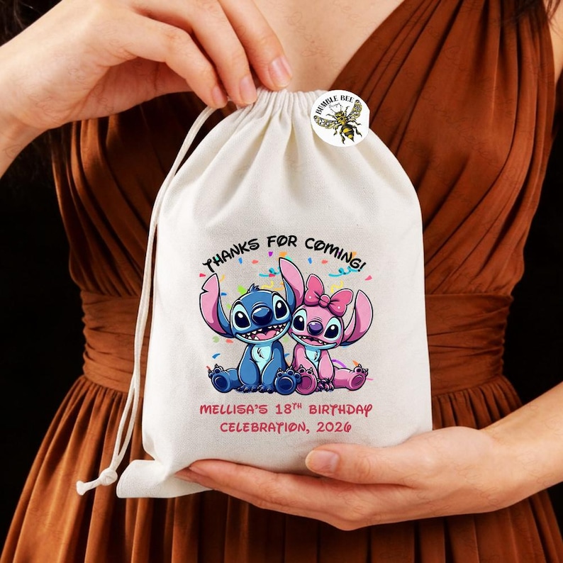 May include: A white drawstring bag featuring a blue and pink cartoon character design with the text "THANKS FOR COMING!" and "MELLISA'S 18TH BIRTHDAY CELEBRATION, 2026". A small round sticker with a bee is attached.