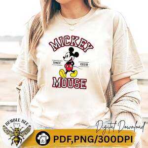 May include: Beige t-shirt featuring a Mickey Mouse graphic. The design includes the words "MICKEY MOUSE" in red and white, with "Since 1928" underneath. The shirt is a digital download, available in PDF and PNG formats.