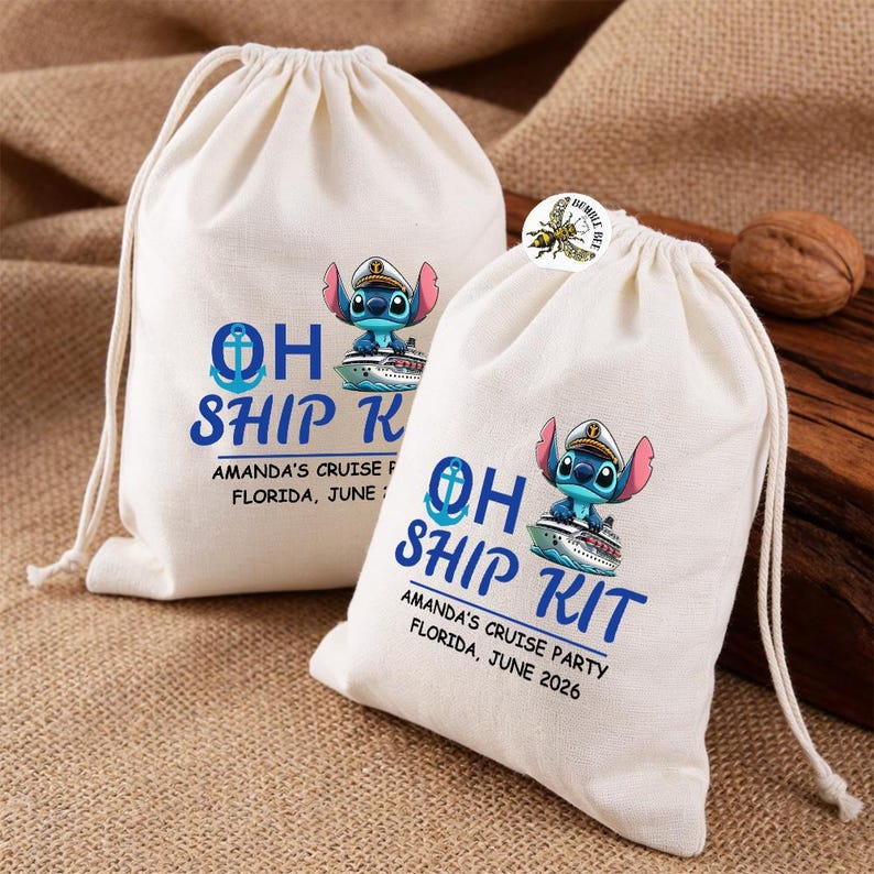 May include: Two off-white drawstring bags with a blue and white graphic. The graphic includes the text "OH SHIP KIT" and a cartoon character on a cruise ship. The text "AMANDA'S CRUISE PARTY FLORIDA, JUNE 2026" is also printed on the bags.