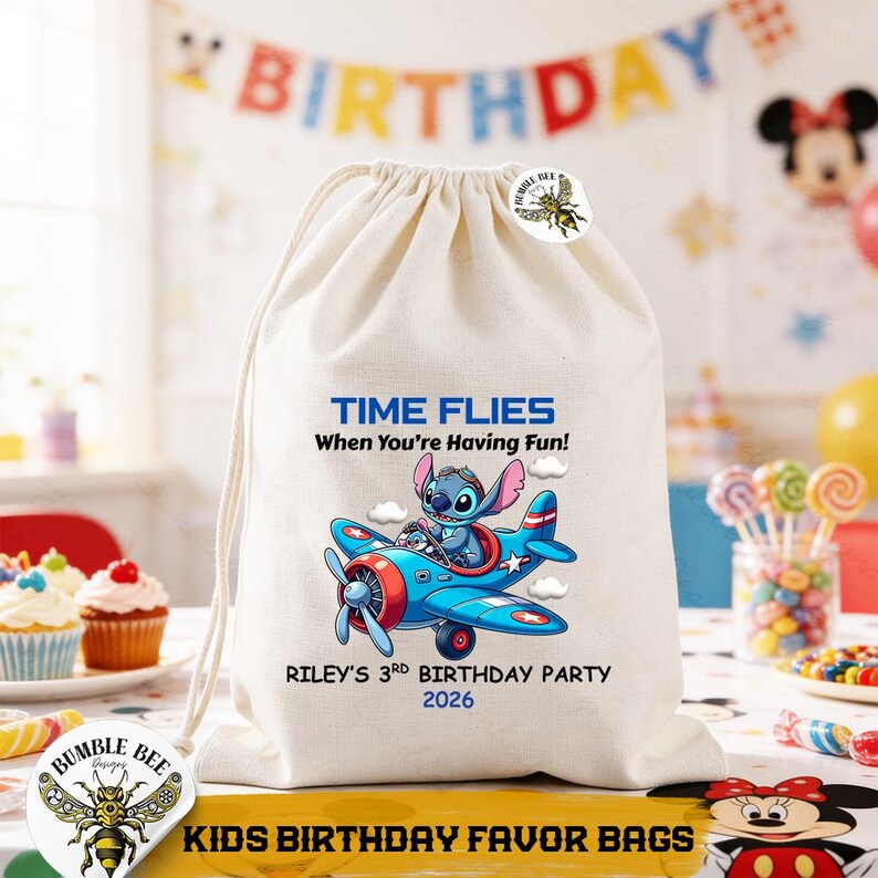 May include: A cream-colored drawstring favor bag with a cartoon image of a blue character in a red and blue airplane. Text on the bag reads "TIME FLIES When You're Having Fun!" and "RILEY'S 3RD BIRTHDAY PARTY 2026". The bag is labeled "KIDS BIRTHDAY FAVOR BAGS".
