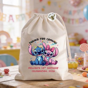 May include: A beige drawstring bag featuring a blue and pink cartoon character design. The bag has the text "THANKS FOR COMING!" and "MELLISA'S 18TH BIRTHDAY CELEBRATION, 2026". A round sticker with a bee is attached to the bag.