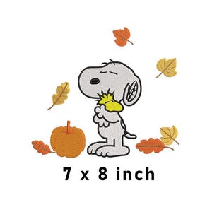 May include: Embroidered Snoopy design featuring Snoopy holding a yellow bird, surrounded by autumn leaves and a pumpkin. The design measures 7 x 8 inches.