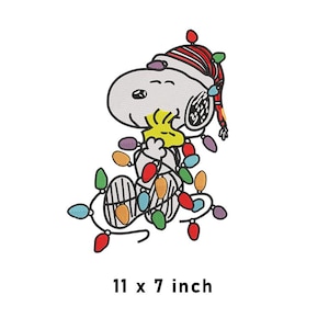 May include: An embroidered patch featuring Snoopy wearing a red and white striped stocking cap, holding a yellow Woodstock, and tangled in a string of multicolored Christmas lights. The patch measures 11 by 7 inches as printed below.