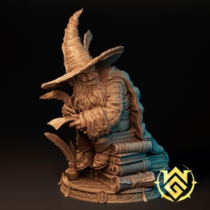 May include: A brown monochromatic figurine of a bearded wizard wearing a tall pointed hat and spectacles, sitting on a stack of books. The wizard holds a quill and parchment, with an inkwell and additional quills placed on the circular base.