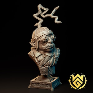 May include: A grey resin bust of a gnome character wearing a riveted helmet, goggles, and a collared shirt with a buckled strap. A lightning bolt shape extends from the top of the helmet. The figure features a prominent mustache and pointed ears.
