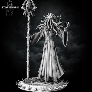 May include: A monochrome figurine of a humanoid creature with tentacle facial features, wearing a long, patterned robe and holding a tall, ornate staff topped with a spiky orb. The base is circular with a cracked texture and protruding spikes. Text reads STORMBORN COLLECTIBLES.