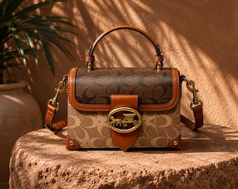 Bolsa vintage com monograma e alça superior, bolsa transversal marrom, bolsa de mão elegante em formato de caixa.