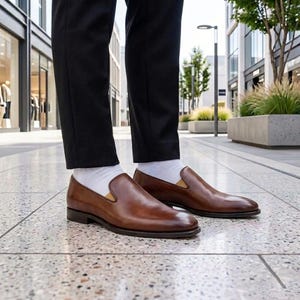 Brown leather loafers ready for a formal wedding outfit