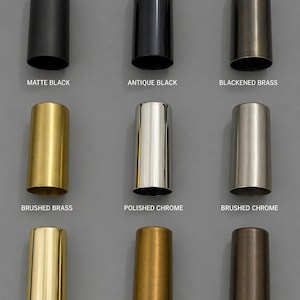 May include: A grid of nine cylindrical metal sleeves in various finishes: matte black, antique black, blackened brass, brushed brass, polished chrome, brushed chrome, polished brass, raw brass, and antique patina, each labelled with its finish name.