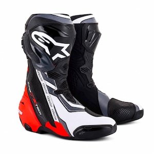 May include: A pair of black, white, and red motorcycle racing boots featuring the Alpinestars logo on the shin guard and the text Supertech printed on the side. The boots have a high-cut design with reinforced panels and mesh detailing.