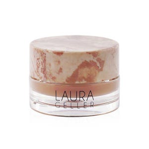 May include: A clear glass jar of makeup with a light brown product inside. The lid is a marbled pattern of beige and brown. The text "LAURA GELLER" is printed in black on the front of the jar.