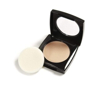 May include: A black compact with a mirror and a round, beige powder. A separate, round, off-white powder puff sits next to the compact. The compact is open, revealing the powder and mirror.