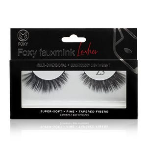 May include: A black box of Foxy fauxmink lashes. The box has a cutout window displaying a pair of dark, tapered false eyelashes. Text on the box reads "MULTI-DIMENSIONAL • LUXURIOUSLY LIGHTWEIGHT" and "SUPER-SOFT • FINE • TAPERED FIBERS".