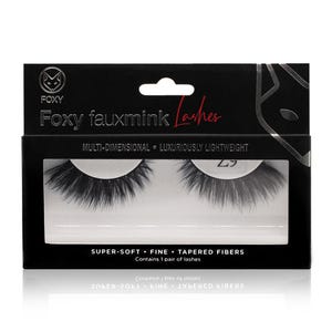 May include: A black box of Foxy fauxmink Lashes. The box has a white window displaying a pair of black, multi-dimensional eyelashes. Text on the box reads "SUPER-SOFT • FINE • TAPERED FIBERS" and "Contains 1 pair of lashes."